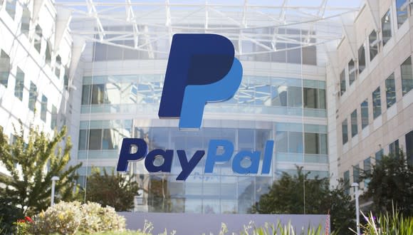 A PayPal building with the PayPal logo on a sign in front of it.