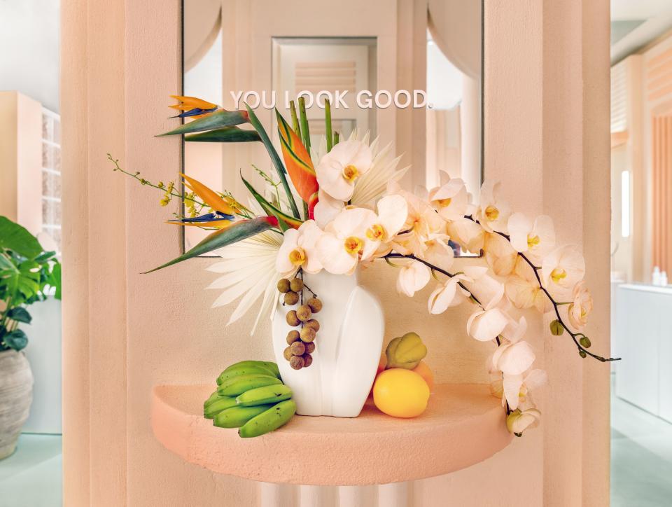 Baby bananas and birds of paradise mingle on an accent table.
