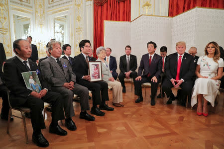 U.S. President Donald Trump and Japan's Prime Minister Shinzo Abe meet with family members of people abducted by North Korea, at Akasaka Palace in Tokyo, Japan May 27, 2019. REUTERS/Jonathan Ernst