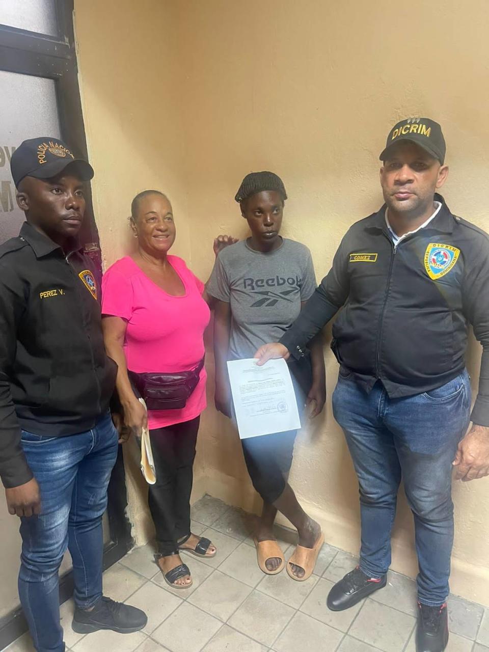 Dominican national Cristina Martínez, in a gray shirt, is reunited with her family two weeks after she disappeared after being arrested by police and taken into immigration custody by Dominican officials who believe she was a Haitian national. Her family says she was subsequently deported to Haiti.