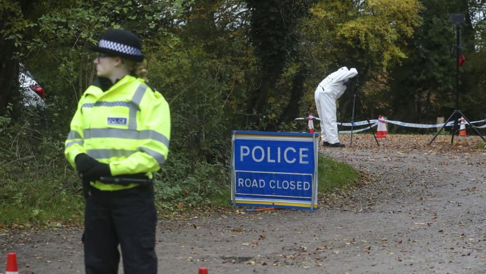 Forensic investigators at Watlington Hill in Oxfordshire after the body of a woman was discovered at the National Trust estate, a man has been arrested on suspicion of murder and is being treated for serious injuries, police said.