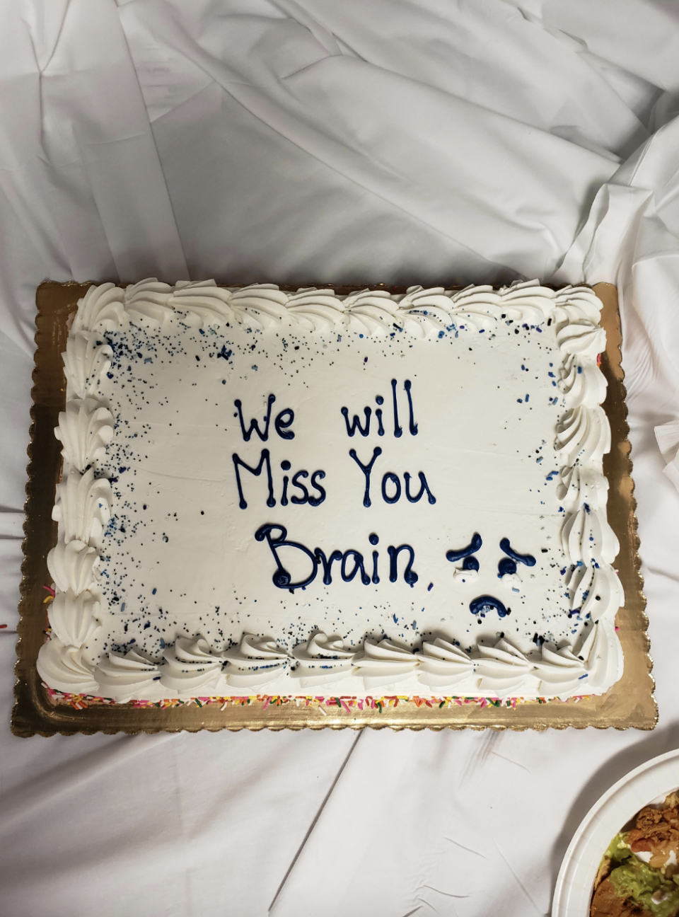 Cake that reads: &quot;We will miss you Brain&quot;
