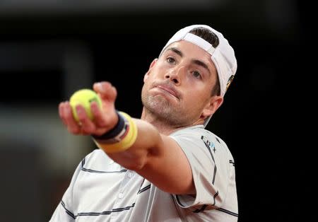 FILE PHOTO: John Isner of the U.S. in action during his Madrid Open quarter final match against Germany's Alexander Zverev REUTERS/Susana Vera