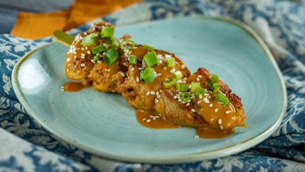 <p>Chicken Skewer with peanut sauce from the Shanghai Holiday Kitchen (China)</p><p>Disney</p>