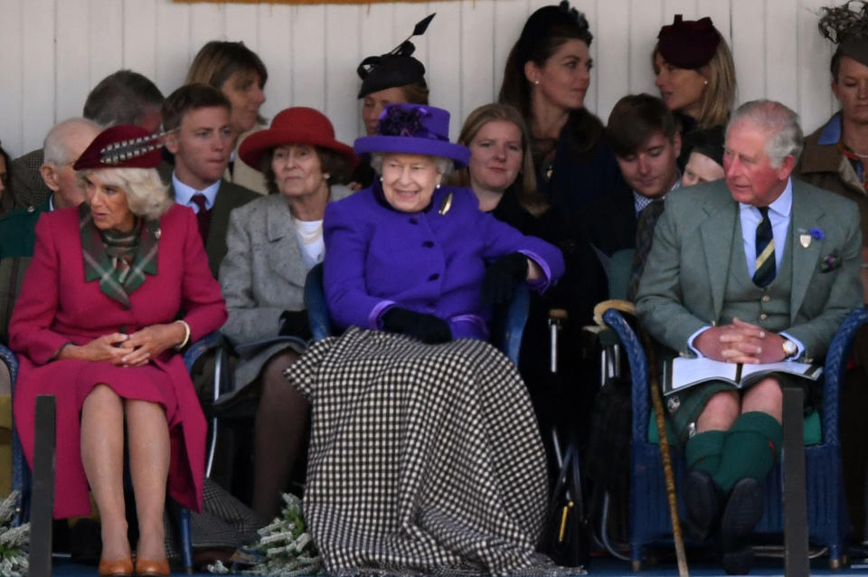 Britain's Queen Elizabeth II, accompanied by Britain's Camilla, Duchess of Cornwall and Britain's Prince Charles, Prince of Wales, looks on during the annual Braemar Gathering in Braemar, central Scotland, on September 7, 2019. - The Braemar Gathering is a traditional Scottish Highland Games which predates the 1745 Uprising, and since 1848 it has been regularly attended by the reigning Monarch Queen Elizabeth and members of the Royal Family. (Photo by ANDY BUCHANAN / AFP)        (Photo credit should read ANDY BUCHANAN/AFP via Getty Images)