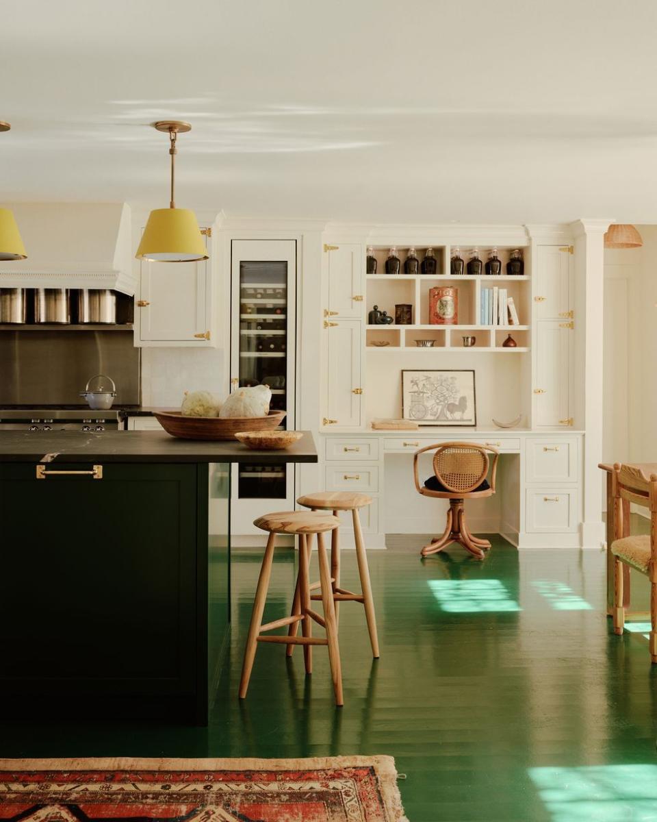 a kitchen with a table and shelves