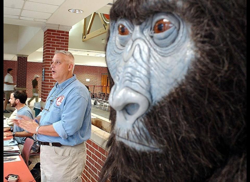 Joedy Cook, director of the Ohio Center for Bigfoot Studies, talks to a visitor to his booth on Oct. 15, 2005, at the Texas Bigfoot Conference in Jefferson, Texas. The event, hosted by the Texas Bigfoot Research Center, drew enthusiasts and researchers of the legendary creature. 