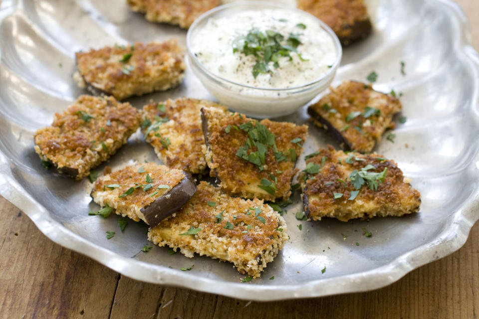 This Oct. 14, 2013 photo shows fried spiced eggplant with cucumber garlic sauce in Concord, N.H. One can make fried foods a little more healthy by changing what one fries. In this case, eggplant. (AP Photo/Matthew Mead)