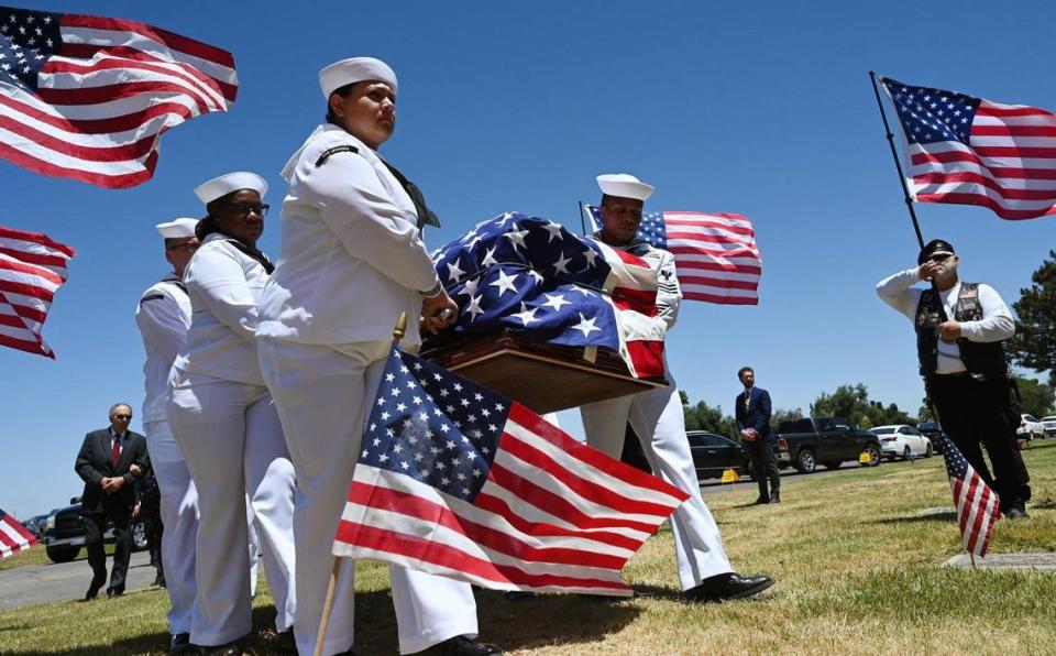 A naval honor guard detail carries the flag-draped casket of Seaman 2nd Class Denver True “D.T.” Kyser, finally identified through modern DNA technology decades later, as he is finally laid to rest at Fresno Memorial Gardens Saturday afternoon, May 21, 2022 in Fresno. Kyser, 18 at the time, was assigned to and serving on the battleship USS Oklahoma when it was attacked by Japanese aircraft as it was moored at Ford Island, Pearl Harbor on Dec. 7, 1941.