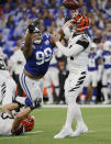 <p>Indianapolis Colts defensive tackle Al Woods (99) pressures Cincinnati Bengals quarterback Andy Dalton (14) during the first half of an NFL football game in Indianapolis, Sunday, Sept. 9, 2018.Dalton threw an interception on the play. (AP Photo/John Minchillo) </p>