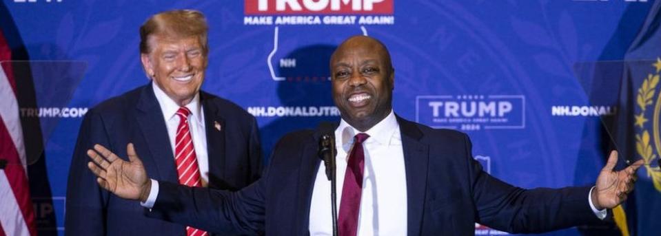 Senator Tim Scott, a Republican from South Carolina, right, speaks as he stands next to former US President Donald Trump during a campaign event in Concord, New Hampshire, US, on Friday, Jan. 19, 2024.