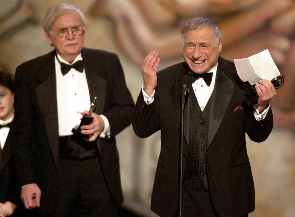 FILE - Thomas Meehan, left, and Mel Brooks, from "The Producers," accept the award for best book of a musical during the 55th annual Tony Awards in New York on June 3, 2001. Brooks released a memoir, "All About Me!: My Remarkable Life in Show Business." (AP Photo/Suzanne Plunkett, File)
