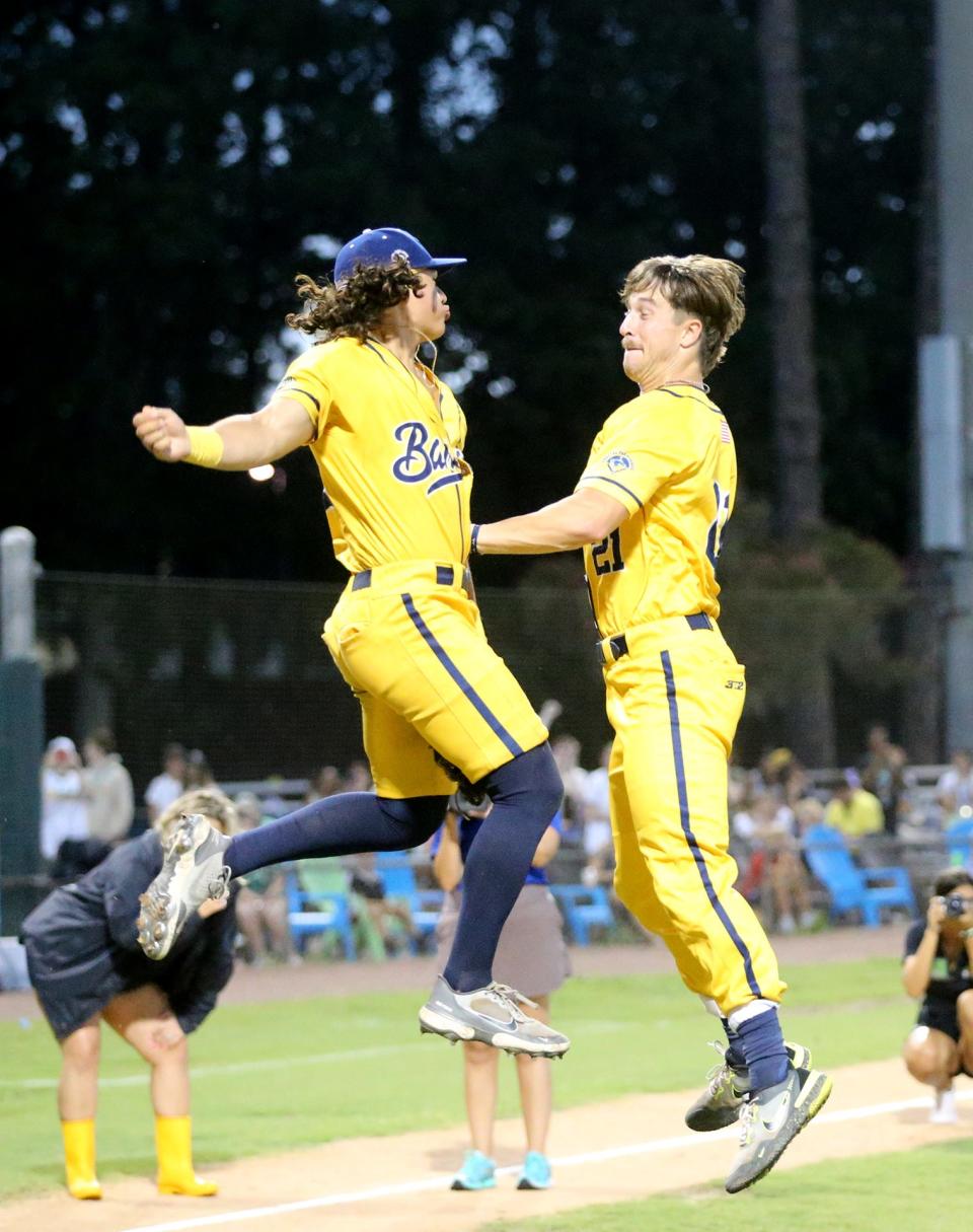 Savannah Banana catcher Indiana Stanley, left, leaps into the air with teammate Jared Donalson during pregame introductions.