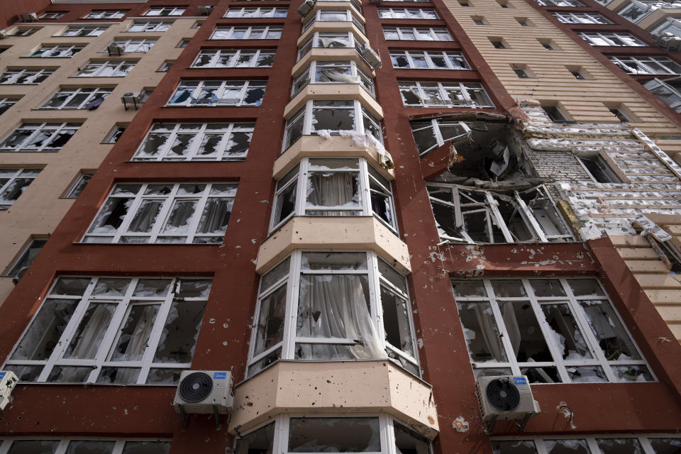 A view of an apartment building damaged by shelling in Irpin, in the outskirts of Kyiv, Ukraine, Monday, April 11, 2022. (AP Photo/Evgeniy Maloletka)