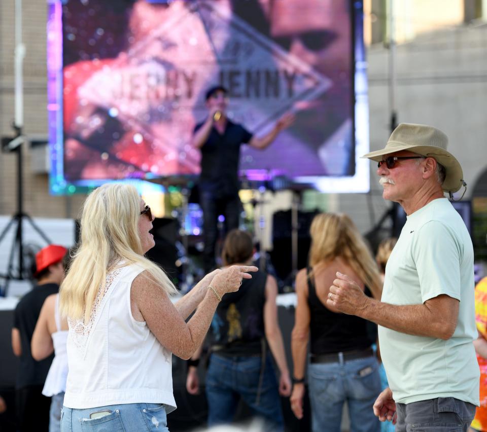 Barb and Steve Hostetler of Canton dance to New Wave Nation at the Massillon Independence Day Celebration on Duncan Plaza in July.