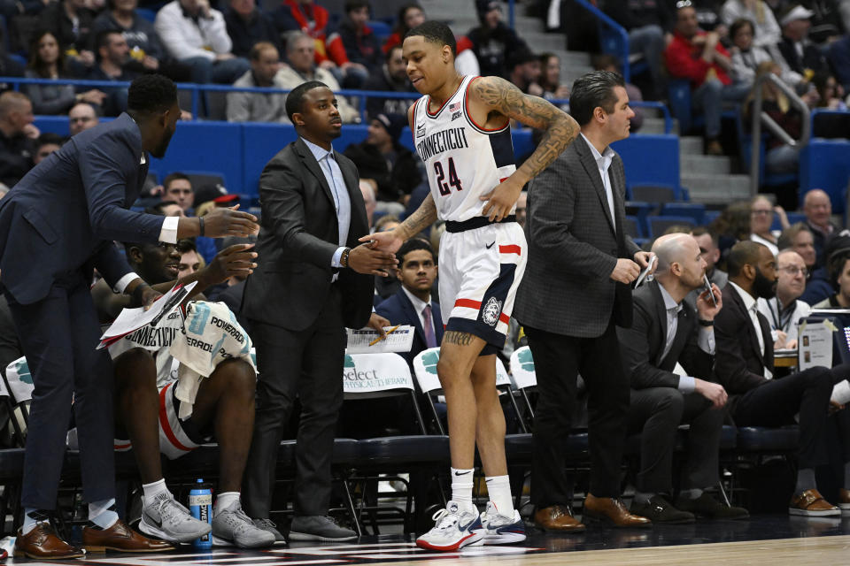 UConn's Jordan Hawkins (24) limps off the court in the second half of an NCAA college basketball game against DePaul, Wednesday, March 1, 2023, in Hartford, Conn. (AP Photo/Jessica Hill)