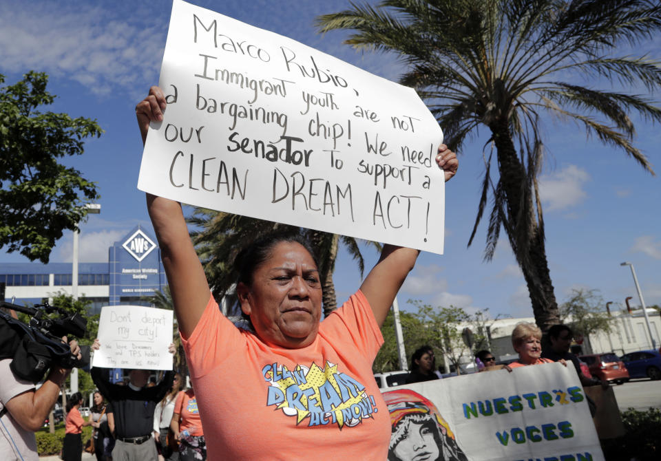 <p>Antonia Catalan marches outside of the office of Sen. Marco Rubio, R-Fla., in support of Deferred Action for Childhood Arrivals (DACA), and Congress passing a clean Dream Act, Monday, Jan. 22, 2018, in Doral, Fla. (Photo: Lynne Sladky/AP) </p>