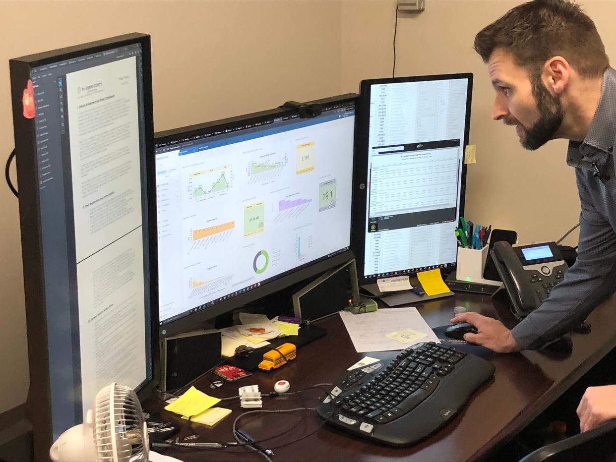 Ryan Rodts, St. Joseph County's fleet director, looks over data he's tracking of the county car usage on the computer screens here in his office in the County-City Building in South Bend.