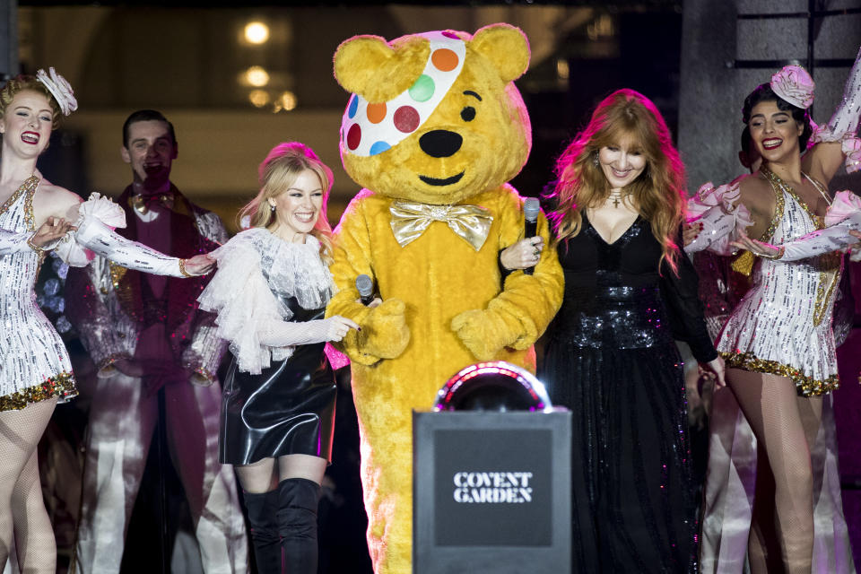 LONDON, ENGLAND - NOVEMBER 14:  Kylie Minogue, Charlotte Tilbury and BBC Children in Need's Pudsey Bear switch on the Covent Garden Christmas lights at Covent Garden on November 14, 2017 in London, England.  (Photo by Tristan Fewings/Getty Images)