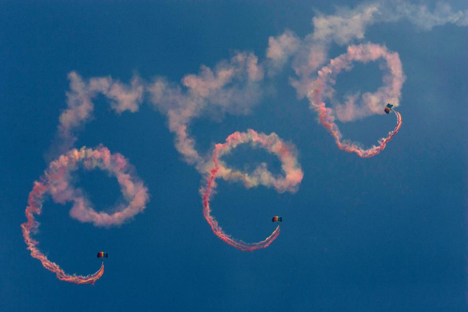Parachutists from China's People's Liberation Army  air force perform at Airshow China in Zhuhai, Guangdong province, in November 2010.