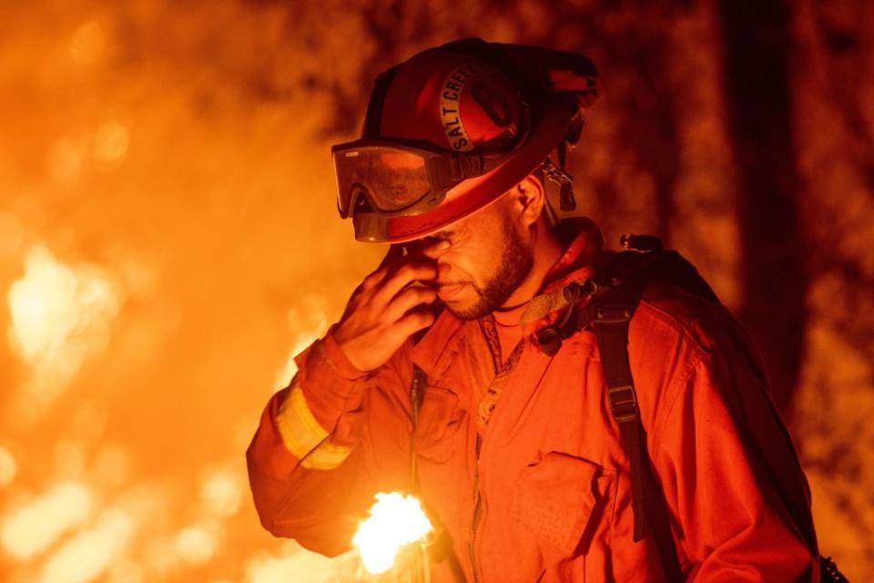 <p>An inmate firefighter pauses during a firing operation as the Carr fire continues to burn in Redding, Calif. on July 27, 2018. One person has died and at least two others have been injured as wind-whipped flames tore through the region. (Photo from Josh Edelson/AFP) </p>