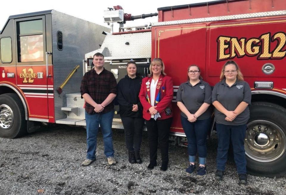 District OH2 2020-21 Gov. Kerry Parker (middle) with senior Explorers (left to right) Kevin Spears, Aspen Otten, Quinn Louck, and Averi Dunivan.