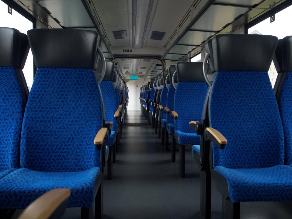 Empty blue seats on a wagon of Alstom's Coradia ilint Hydrogen train.