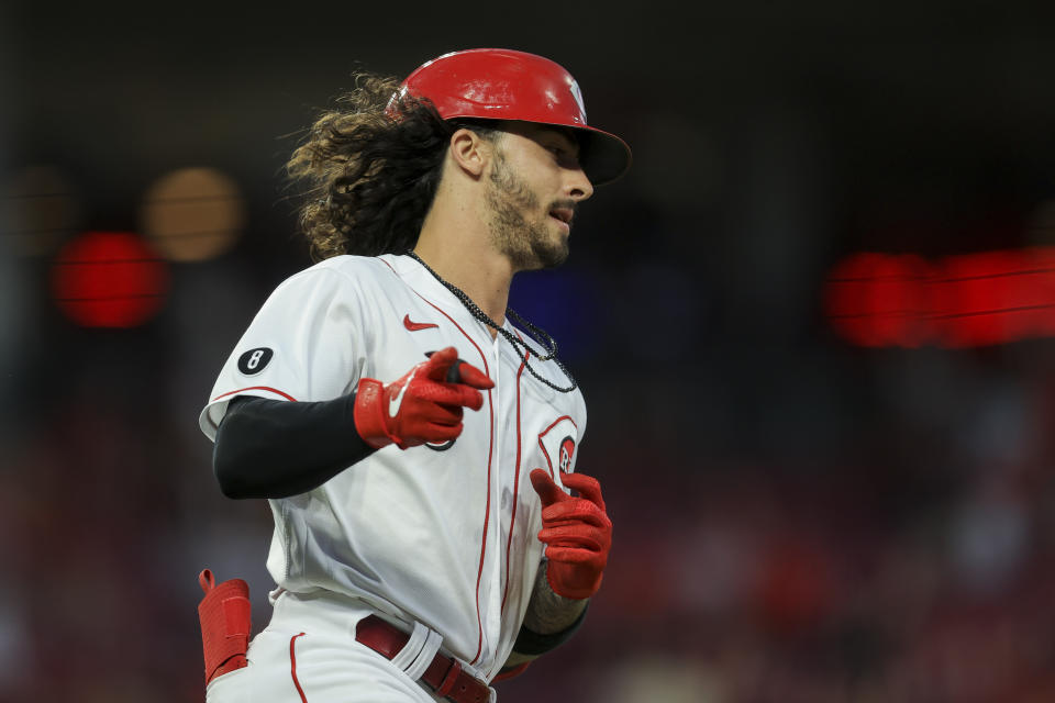 Cincinnati Reds' Jonathan India points as he runs the bases after hitting a two-run home run during the fifth inning of a baseball game against the Minnesota Twins in Cincinnati, Tuesday, Aug. 3, 2021. (AP Photo/Aaron Doster)