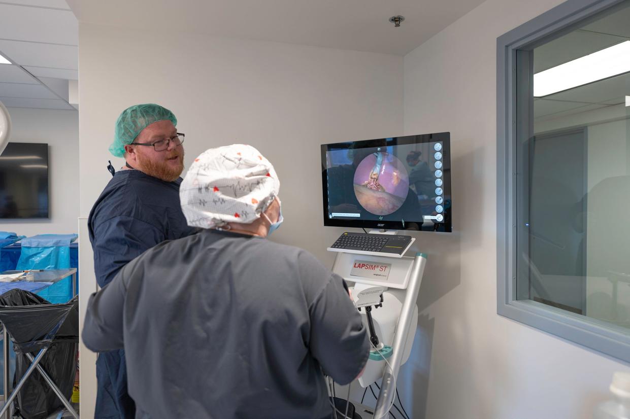 Joshua Strong, left, helps instruct nursing student Megan VanEgmond in the surgery tech lab at the Pueblo Community College Nursing and Allied Health Teaching and Learning Center in the East Tower at St. Mary-Corwin on Thursday, Jan. 26, 2023.