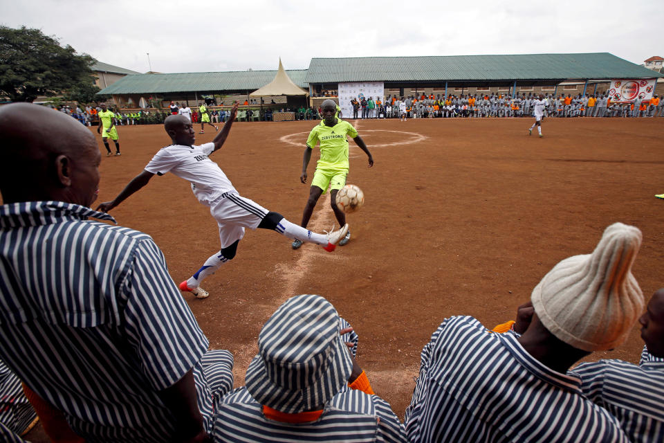 <p>Kenyan prisoners watch a mock World Cup soccer match between Russia and Saudi Arabia, as part of a monthlong soccer tournament involving eight prison teams at the Kamiti Maximum Security Prison, Kenya’s largest prison facility, near Nairobi, on June 14, 2018. (Photo: Baz Ratner/Reuters) </p>