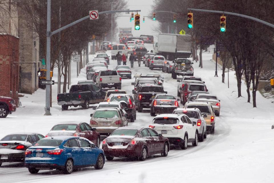 Inbound Dawson Street is littered with traffic after some folks abandoned their cars trying to enter downtown during a winter storm just before 4 pm on Wednesday February 12, 2014. Robert Willett/rwillett@newsobserver.com