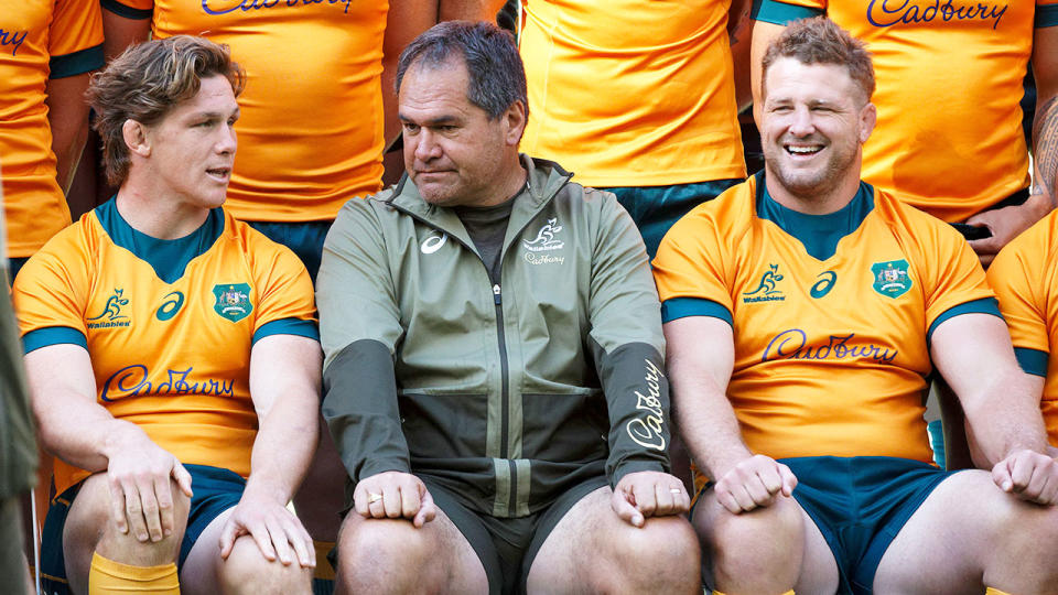 Pictured in the centre, Wallabies coach Dave Rennie poses for a photo with his team.