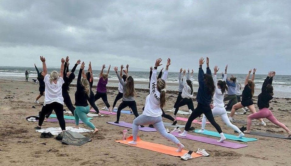 Paula McGuire - Beach yoga