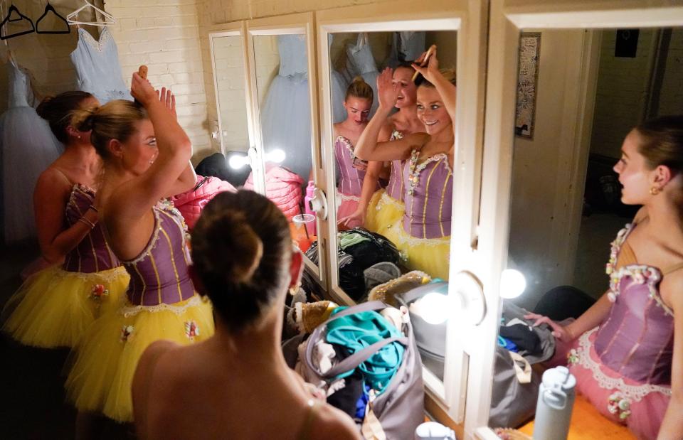 Allie Plott, Lydia Smith, Madeline Evans and Ellie Boulware, members of The Tuscaloosa Community Dancers, prepare for a dress rehearsal of The Nutcracker at the Bama Theatre in Tuscaloosa, Ala.