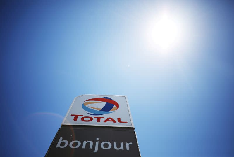 FILE PHOTO: The logo of French oil and gas company Total is seen above a petrol station in Cape Town