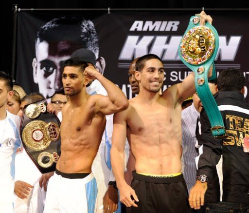 Britain's Amir Khan (L) and American Danny Garcia at the official weigh-in on July 13 in Las Vegas. Khan and undefeated Garcia meet in a light-welterweight title unification showdown on Saturday with each fighter seeking a victory to launch him to another level