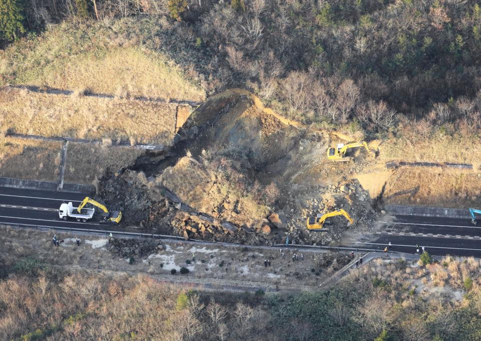 A portion of a highway is blocked by a landslide after an earthquake hit the city, in Soma, Fukushima prefecture, northeastern Japan, Sunday, Feb. 14, 2021. A strong earthquake hit off the coast of northeastern Japan late Saturday, shaking Fukushima, Miyagi and other areas, but there was no threat of a tsunami, officials said.(Hironori Asakawa/Kyodo News via AP)