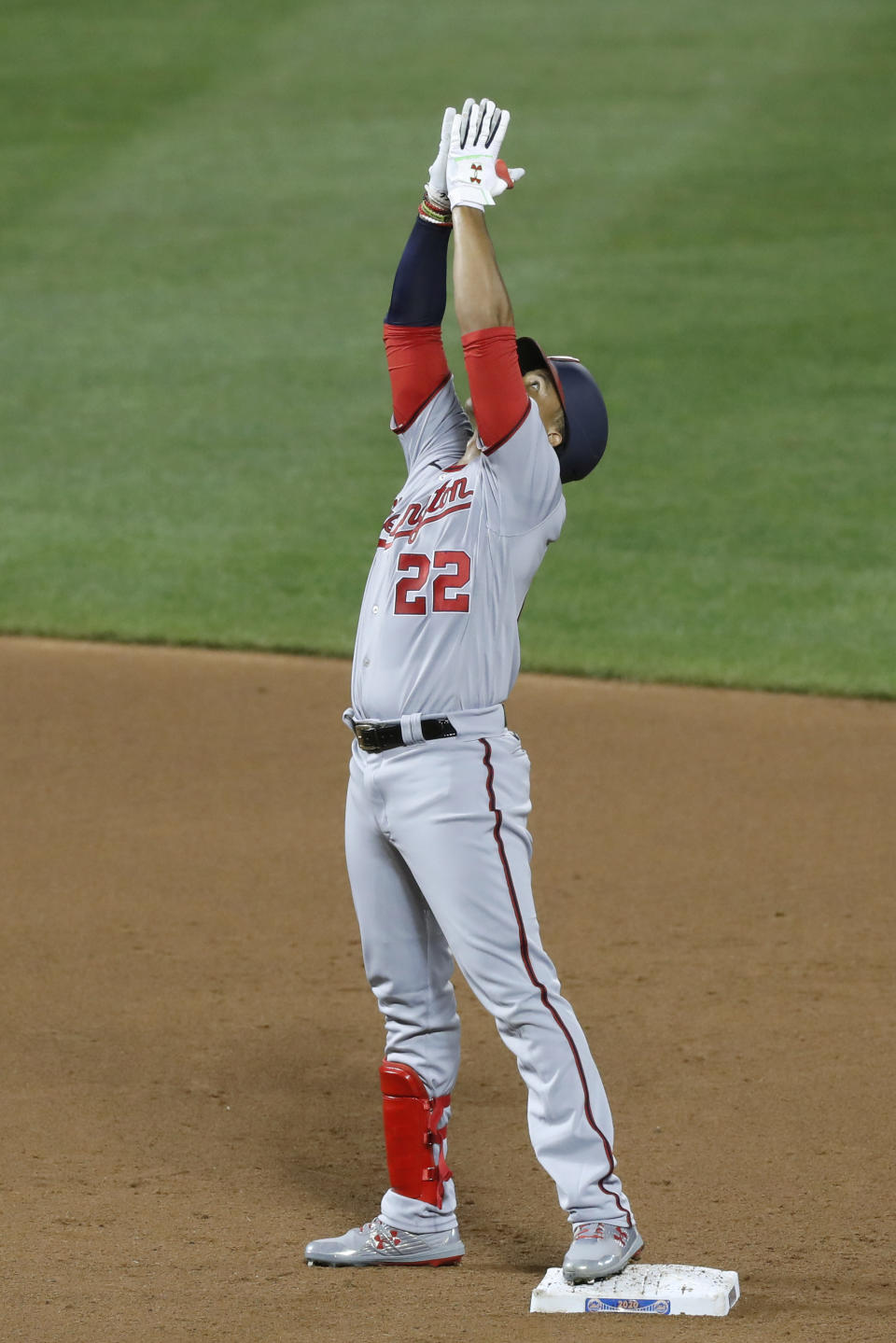 Washington Nationals' Juan Soto reacts after hitting an RBI-double during the fifth inning of a baseball game against the New York Mets, Monday, Aug. 10, 2020, in New York. (AP Photo/Kathy Willens)