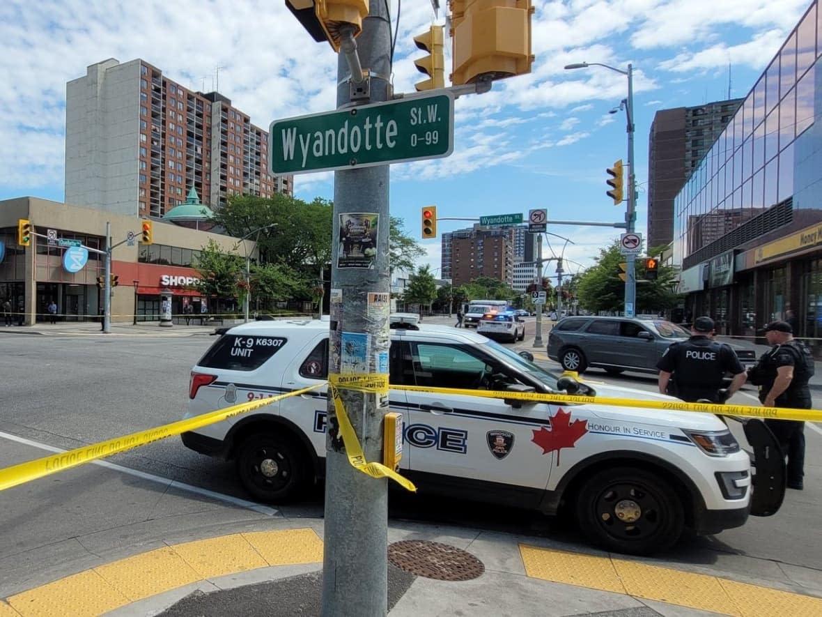 Police have blocked the intersection of Wyandotte Street and Ouellette Avenue in downtown Windsor due to a shooting incident. (Mike Evans/CBC - image credit)