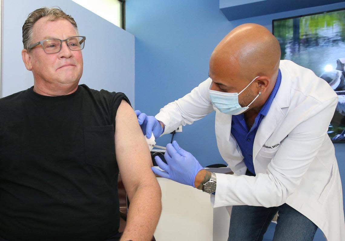 Duane Rinde, 57, an Oakland Park resident, receives the monkeypox vaccine administered by nurse practitioner Joel Ramos at Latinos Salud in Wilton Manors on Wednesday, July 20, 2022. He also received the meningococcal disease vaccine after hearing about a friend in Texas who contracted the illness.