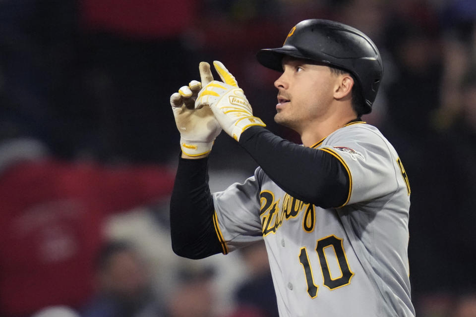 Pittsburgh Pirates' Bryan Reynolds celebrates while rounding the bases on his solo home run off Boston Red Sox starting pitcher Nick Pivetta during the third inning of a baseball game at Fenway Park, Tuesday, April 4, 2023, in Boston. (AP Photo/Charles Krupa)