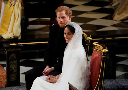 Prince Harry and Meghan Markle in St George's Chapel at Windsor Castle during their wedding service in Windsor, Britain, May 19, 2018. Owen Humphreys/Pool via REUTERS