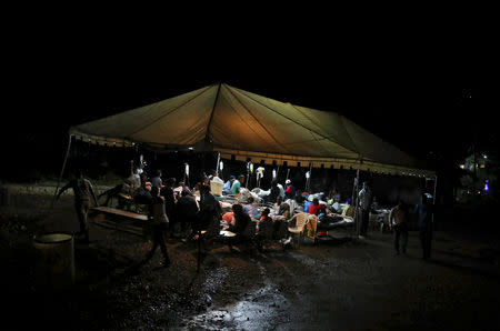 People injured in an earthquake that hit northern Haiti late on Saturday, are being looked after in a tent, in Port-de-Paix, Haiti, October 7, 2018. REUTERS/Ricardo Rojas