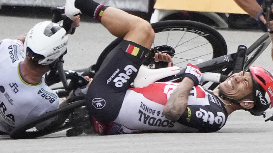 Team Lotto Soudal's Caleb Ewan reacts as he falls with Team Bora Hansgrohe's Peter Sagan of Slovakia close to the finish line of the 3rd stage of the Tour de France. (Photo by CHRISTOPHE ENA/AFP via Getty Images)