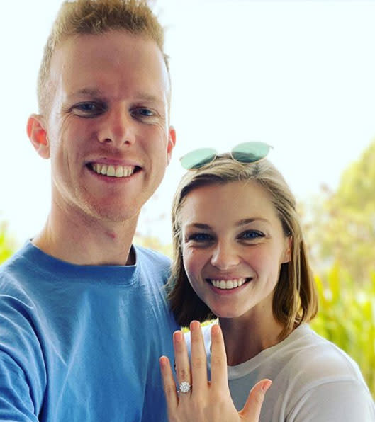 A photo of Gogglebox star Adam Densten and his new fiancée Rachel Falconer showing off her engagement ring.