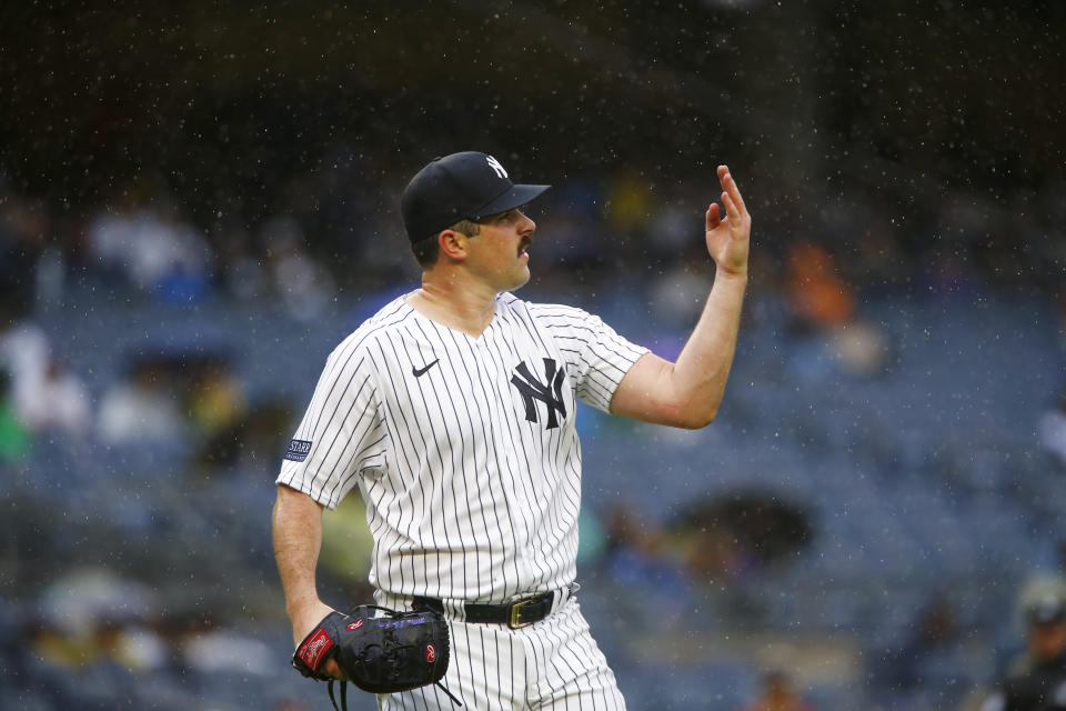 New York Yankees pitcher Carlos Rondon looks at his hand after throwing to first base to retire Arizona Diamondbacks batter Alek Thomas in the top of the fifth inning during a baseball game Sunday, Sept. 24, 2023, in New York. (AP Photo/John Munson)