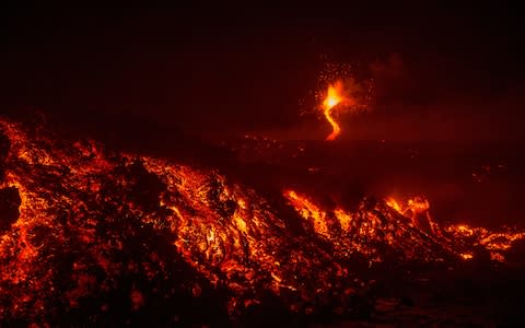 Mount Etna, Europe's most active volcano, spews lava during an eruption, near the Sicilian town of Catania, southern Italy. - Credit: Salvatore Allegra