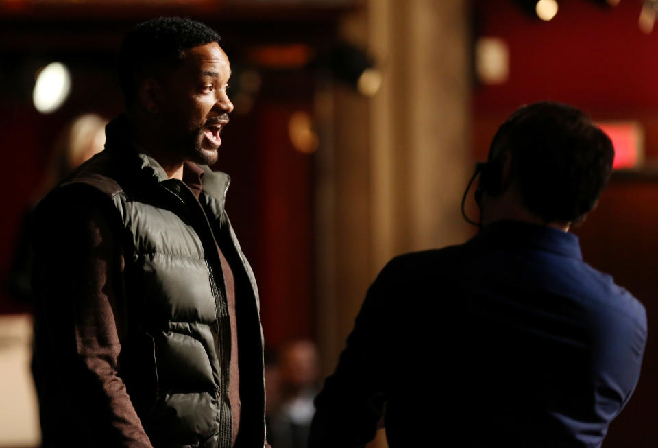 Will Smith, left, stands onstage during rehearsals for the 86th Academy Awards in Los Angeles, Saturday, March 1, 2014. The Academy Awards will be held at the Dolby Theatre on Sunday, March 2. (Photo by Matt Sayles/Invision/AP)