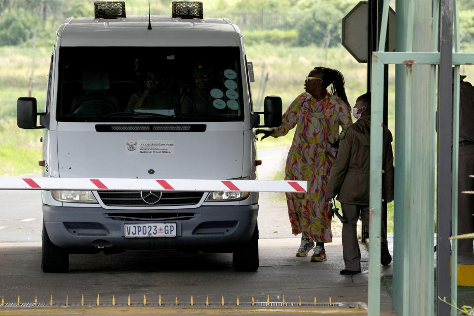 Prison officials inspects a vehicle leaving the Correctional Services prison in Pretoria, South Africa, Friday, Jan. 5, 2024. South African athlete Oscar Pistorius has been released from prison on parole after serving nearly nine years in prison for killing his girlfriend and is now at home, South Africa's Department of Corrections said Friday. (AP Photo/Themba Hadebe)