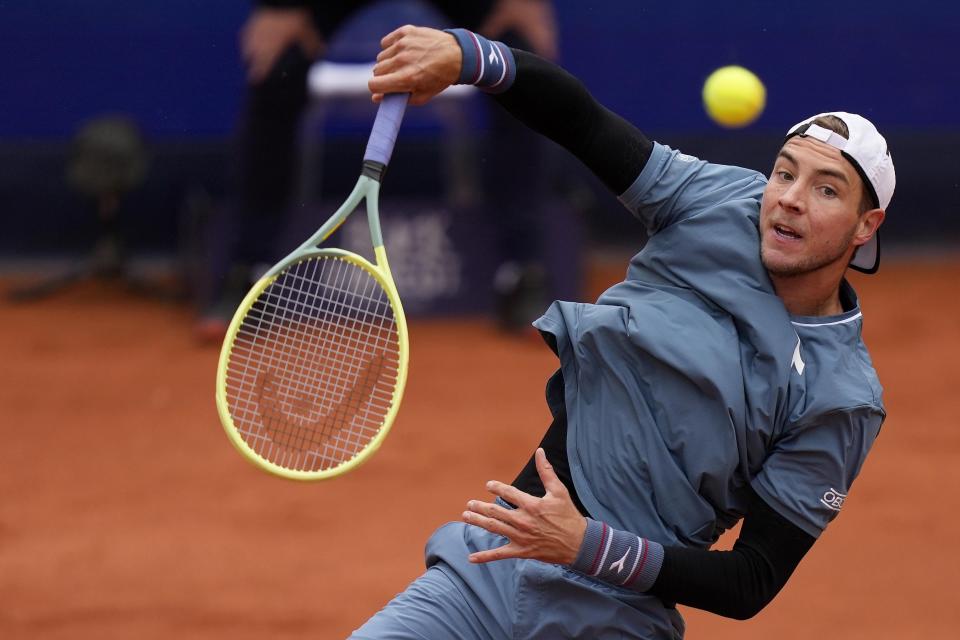 Jan-Lennard Struff of Germany returns the ball during the final match against Taylor Fritz of the United States at the Tennis ATP tournament in Munich, Germany, Sunday, April 21, 2024. (AP Photo/Matthias Schrader)